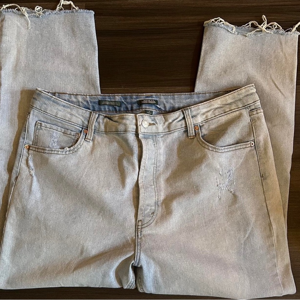 Baggy light blue jeans.